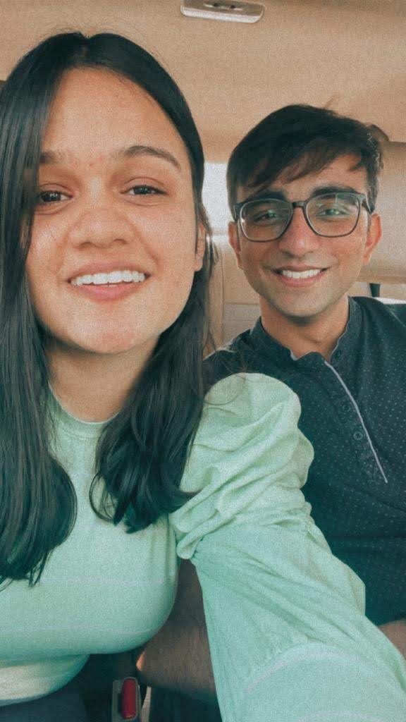 Bilv and Vinanti smiling together in the car
