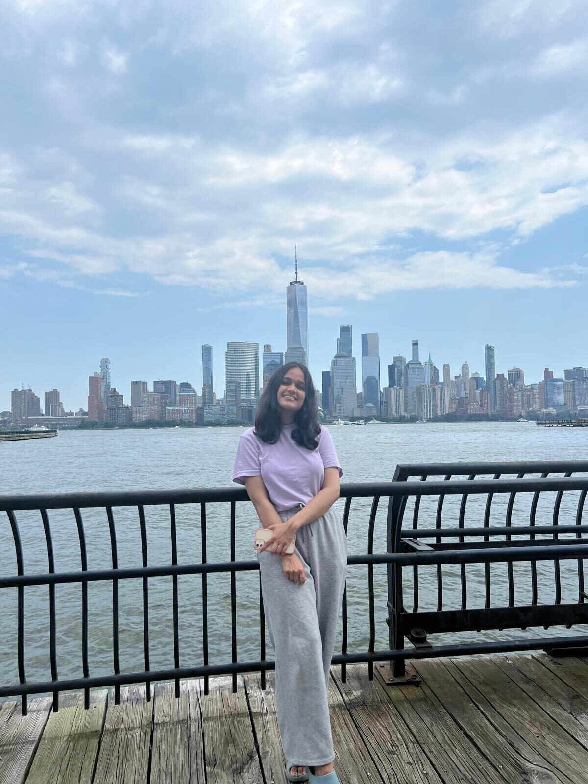 Vinanti smiling in front of the New York skyline